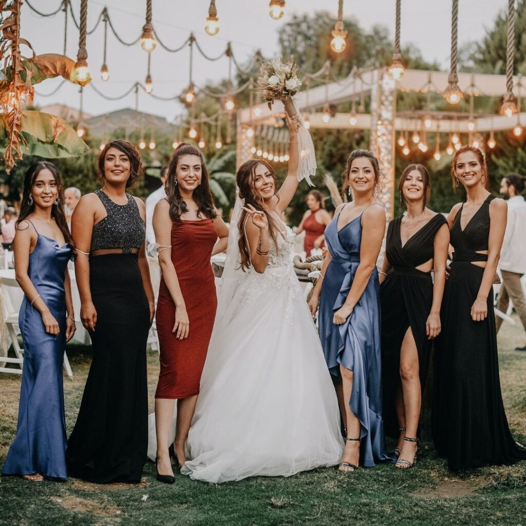 A guest wearing casual clothes (jeans and sneakers) at a formal wedding event