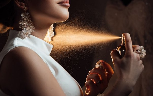 Why it is advised to spray a perfume 15cm away from your body?