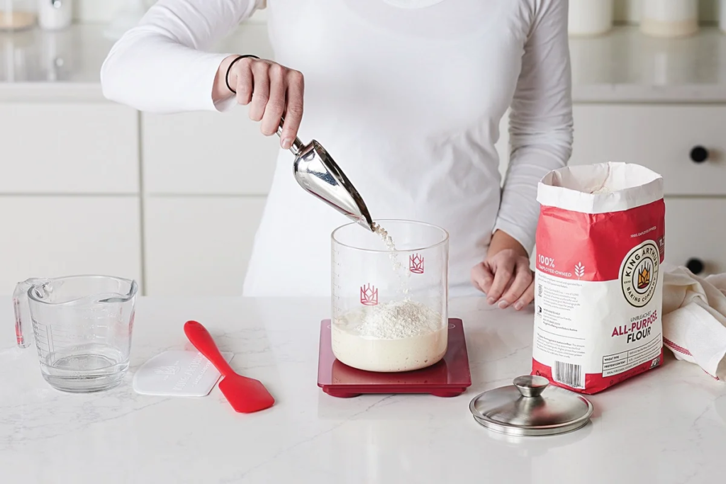 Step-by-step image of someone using a kitchen scale to measure dry ingredients in ounces.