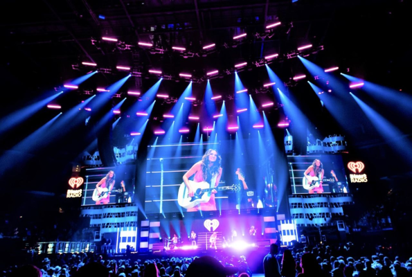 A stage setup with lights and musical instruments, showcasing the anticipation for the big performance on super Bowl 2025