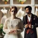 A dramatic and emotionally charged scene showing a young woman looking shocked and uncomfortable in a bridal shop. She is holding a wedding dress whil