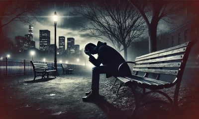 A dramatic and somber scene depicting a person sitting alone on a park bench at dusk, surrounded by a desolate, empty environment. They have their hea